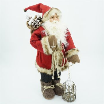 Red Santa Claus with wooden basket and hessian sack